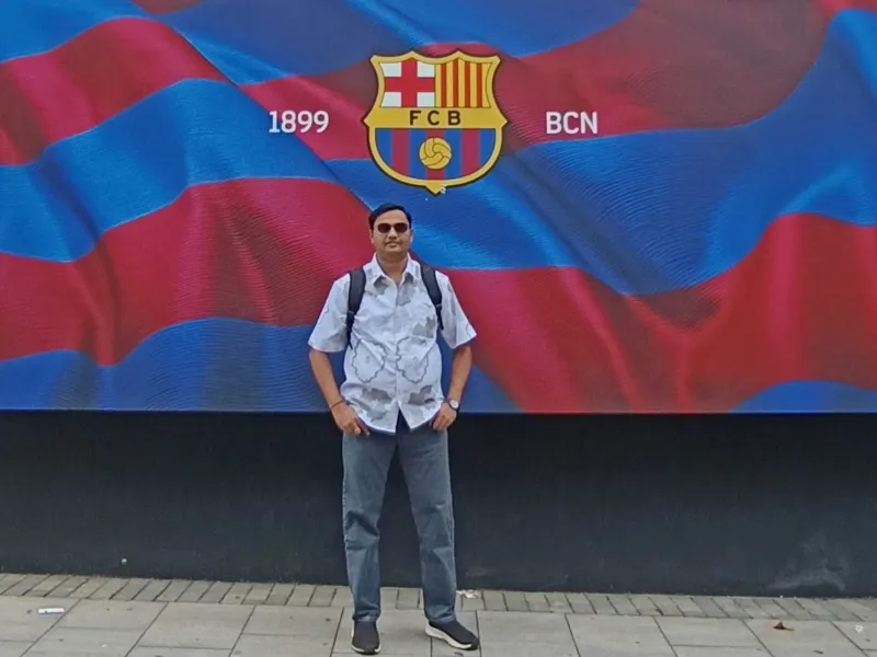 Akshay Joshi in front of an FCB banner