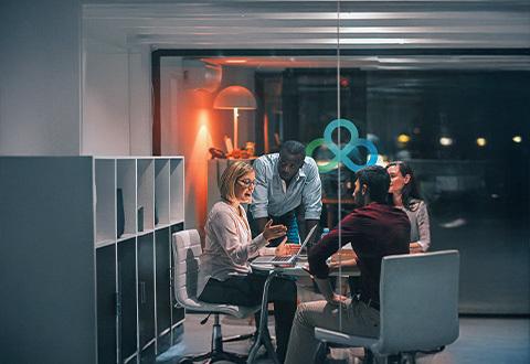 4 colleagues around a table