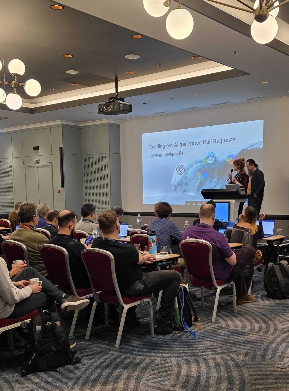 Floor Drees and Jonathan Gonzalez presenting at FOSDEM PGDay