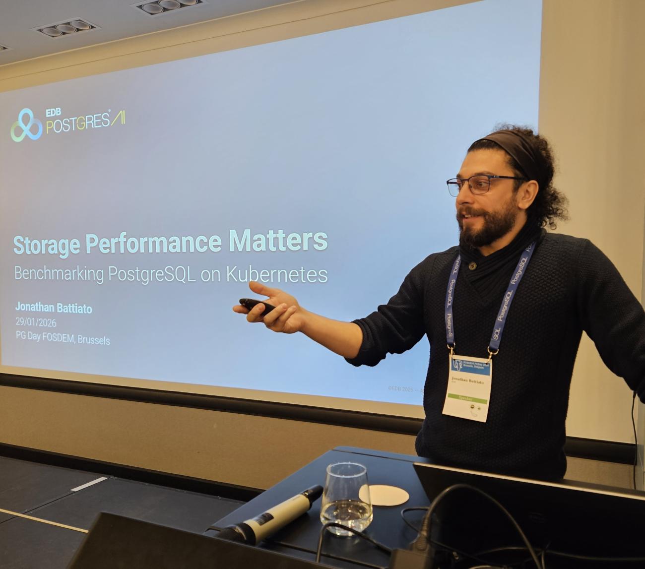 Jonathan Battiato presenting at FOSDEM PGDay