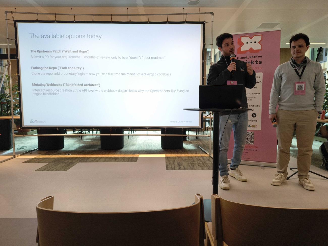 Gabriele Fedi and John Long during their Cloud Native Rejekts talk