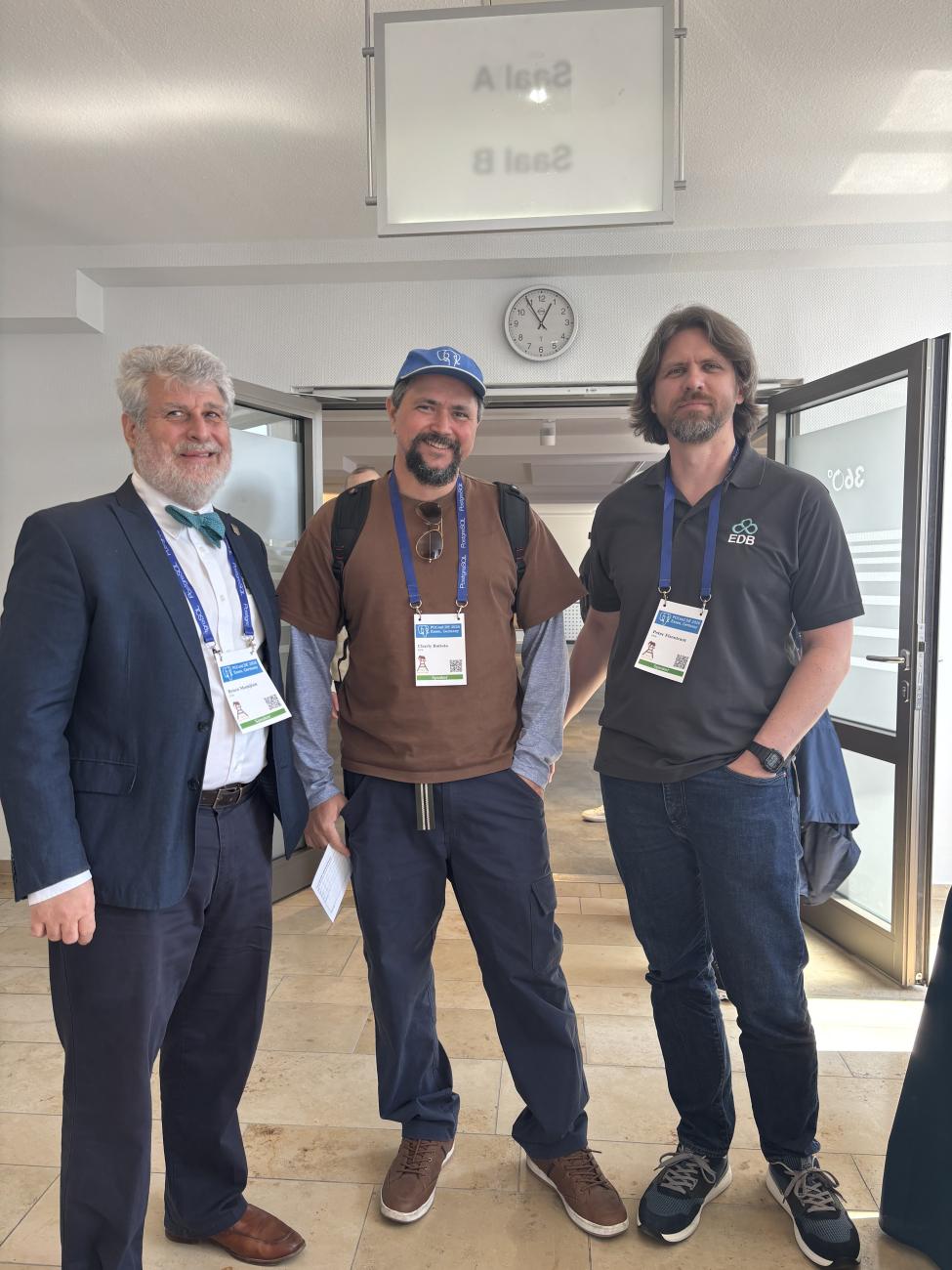 Bruce Momjian, Charly Batista, and Peter Eisentraut at PGConf DE