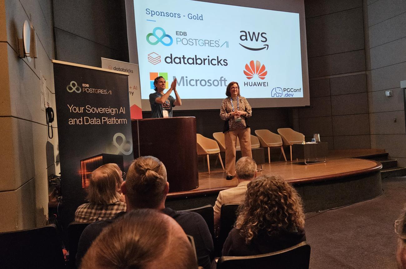 Robert Haas opening the conference, with Claire Giordano