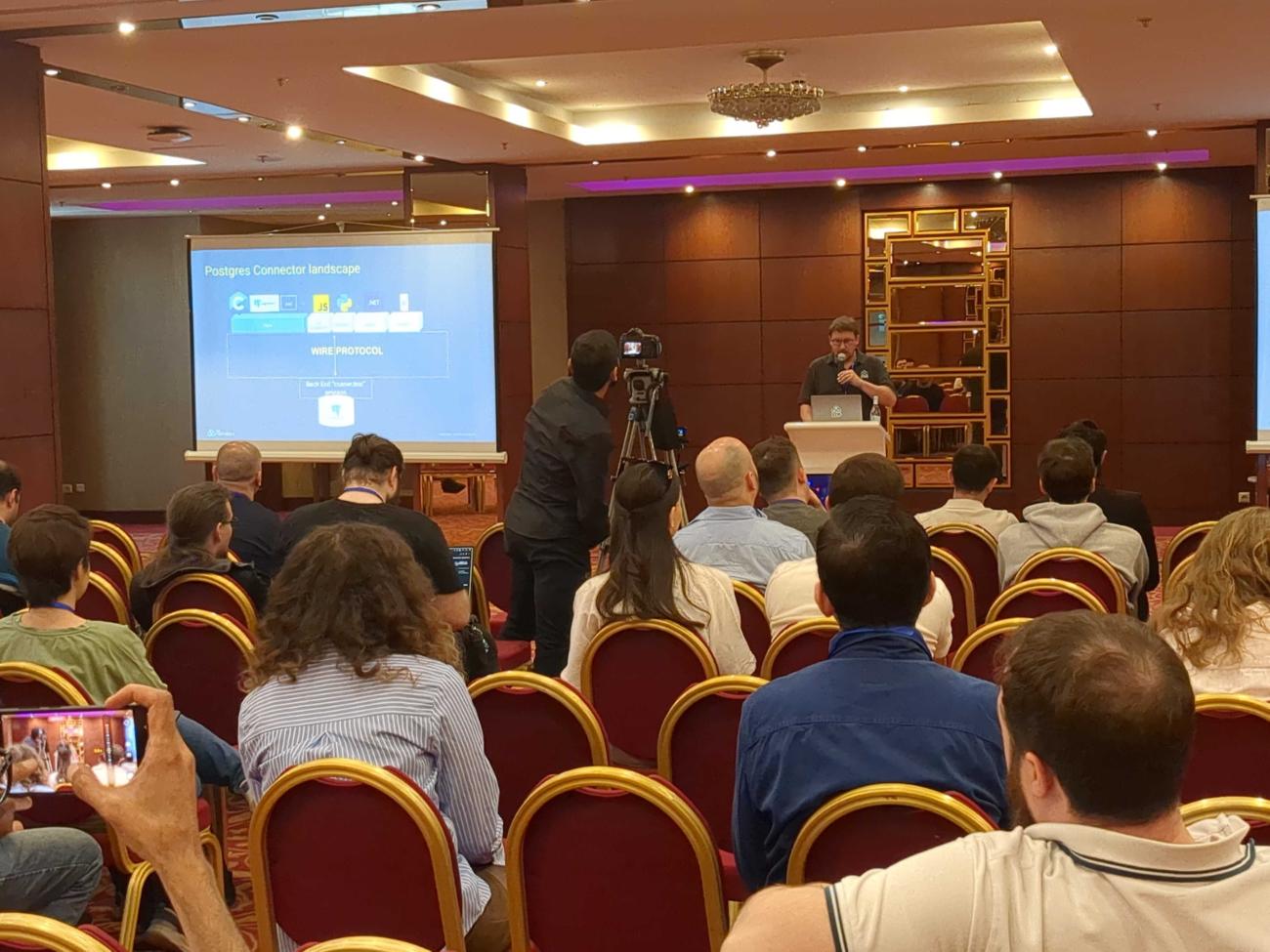 Xavier Fischer presenting his talk at PGDay Armenia