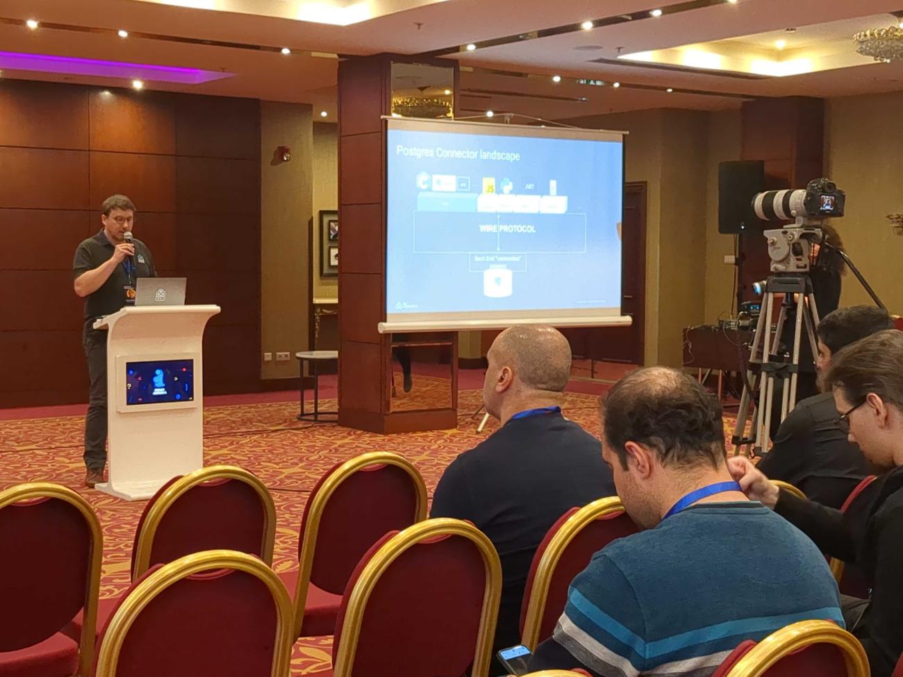 Xavier Fischer presenting his talk at PGDay Armenia
