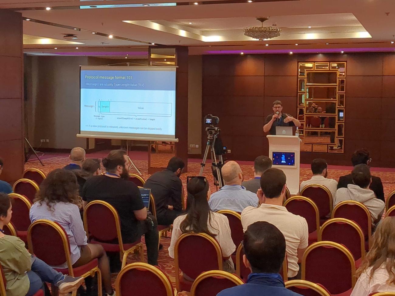 Xavier Fischer presenting his talk at PGDay Armenia