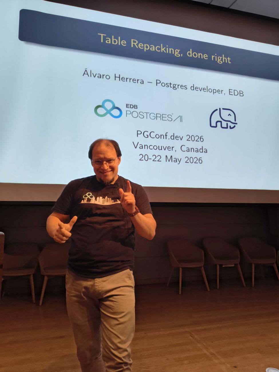 Alvaro Herrera gets ready for his talk - finger guns blazing