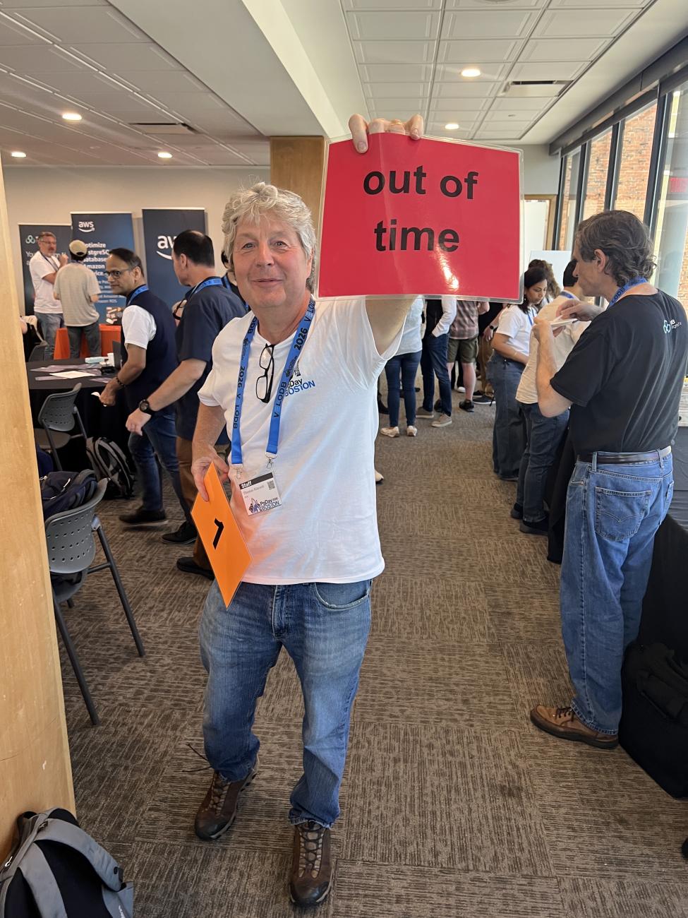 Tom Kincaid holding a sign saying "out of time"