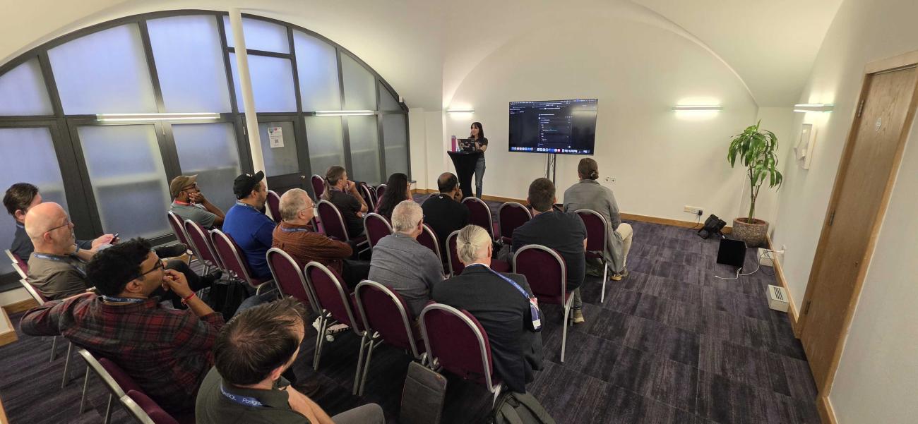 Bilge Ince presenting her session at PGDay UK